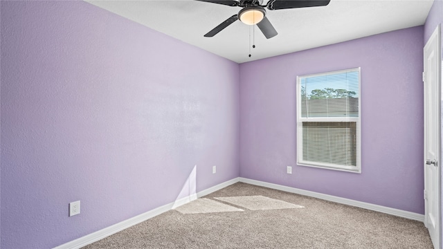 empty room with carpet flooring and ceiling fan