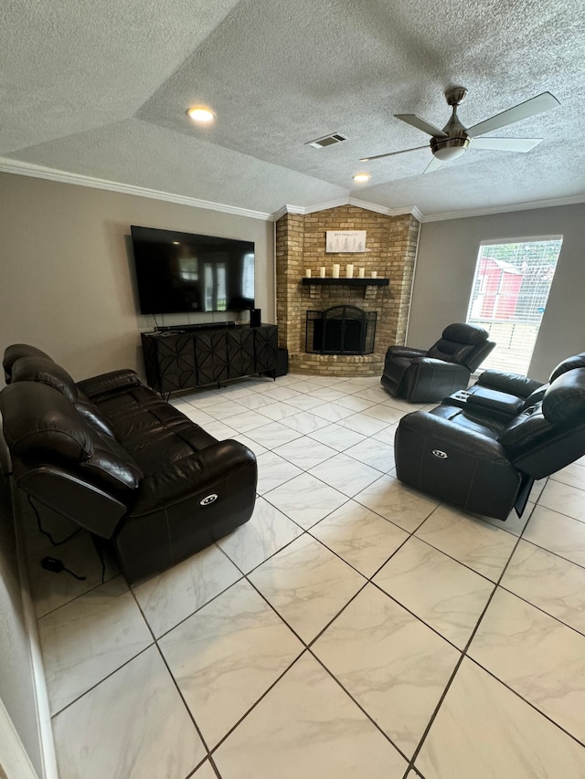 living room featuring crown molding, light tile patterned flooring, a brick fireplace, a textured ceiling, and ceiling fan