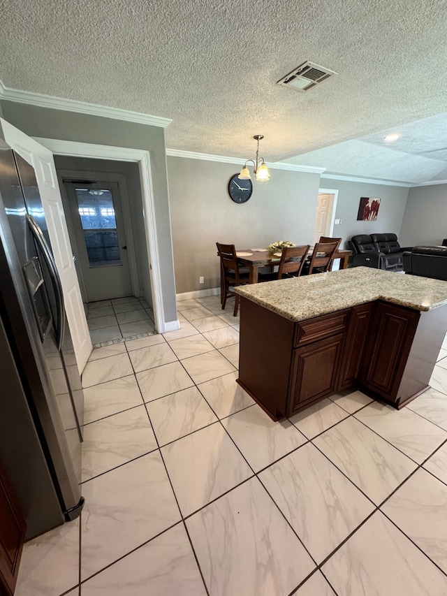 kitchen featuring a textured ceiling, dark brown cabinets, light stone counters, ornamental molding, and stainless steel fridge with ice dispenser