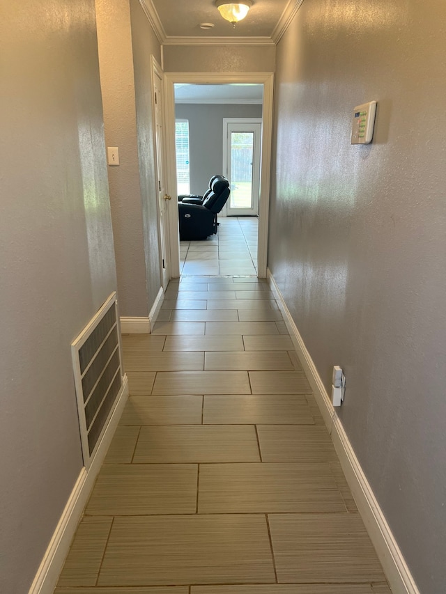 hallway featuring ornamental molding