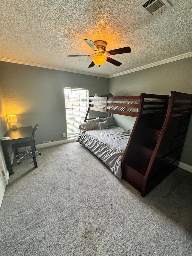 8609 Lynwood Ln, Port Arthur, TX 77642 - bedroom with a textured ceiling, visible vents, crown molding, carpet floors, and baseboards