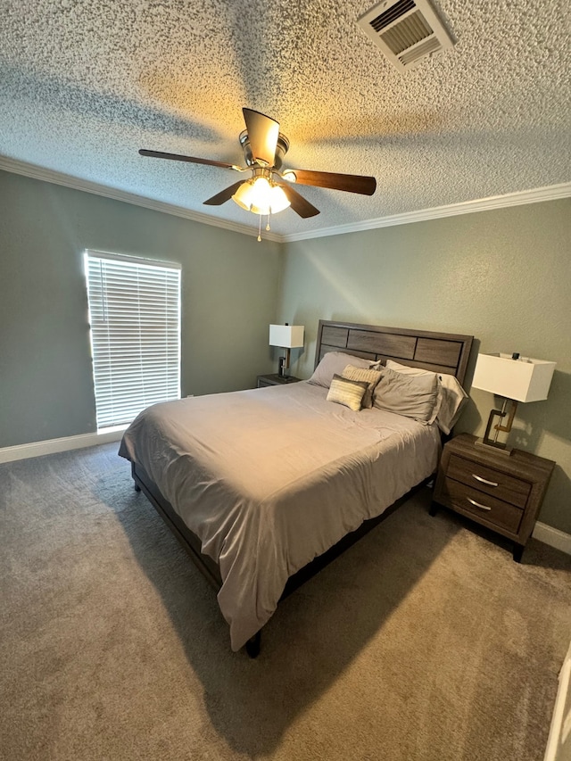 carpeted bedroom featuring ceiling fan, crown molding, and a textured ceiling