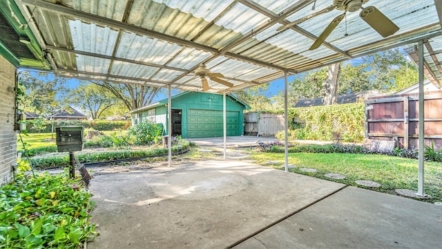 view of patio featuring a storage shed and ceiling fan