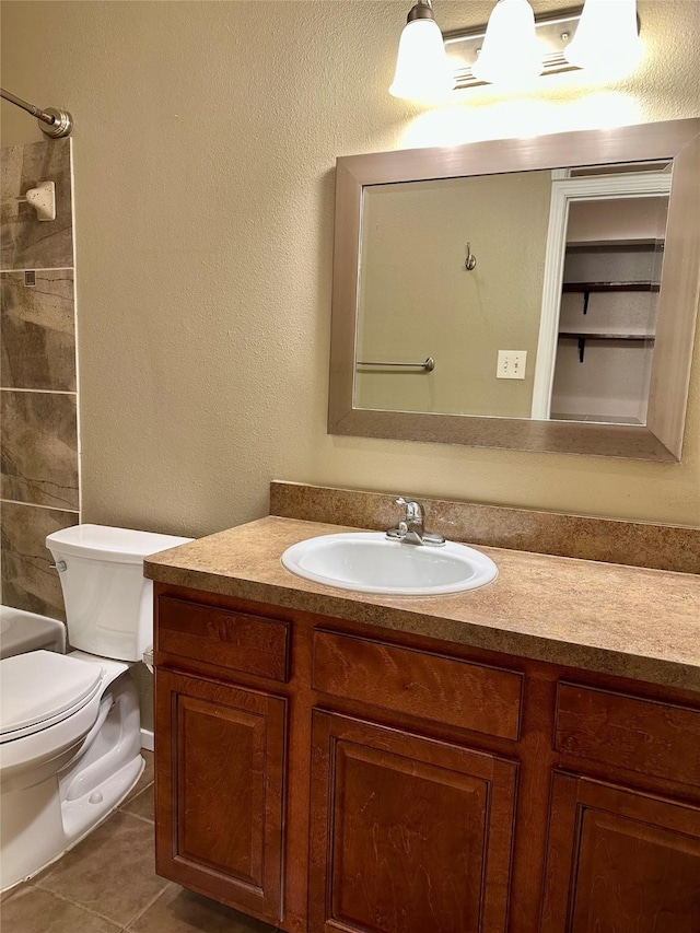 7029 N Holiday Dr, Galveston, TX 77550 - bathroom featuring tile patterned floors, toilet, washtub / shower combination, and vanity