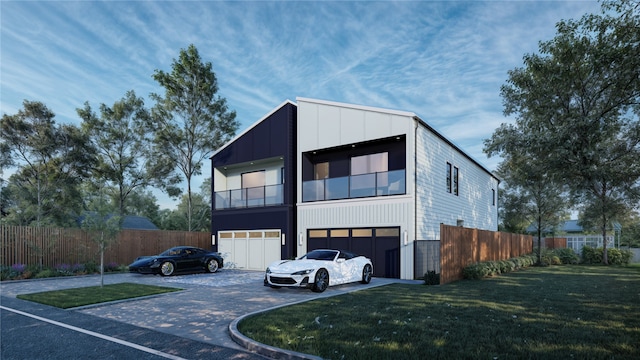 contemporary home featuring a front yard and a garage