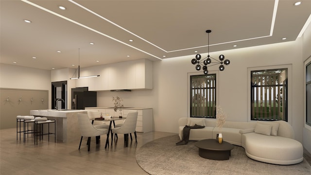 dining space featuring sink and light wood-type flooring