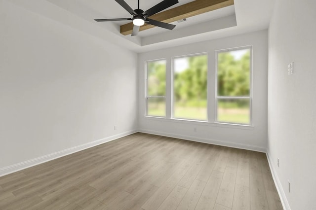 4622 Sycamore Way Rd, Fulshear, TX 77441 - spare room featuring a raised ceiling, a ceiling fan, and wood finished floors