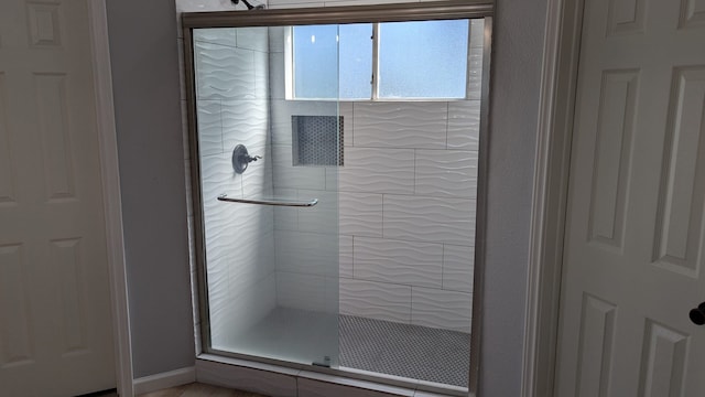 bathroom featuring an enclosed shower