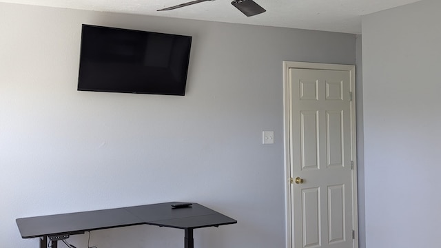 interior space featuring ceiling fan