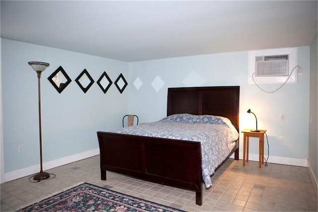 bedroom featuring a wall unit AC