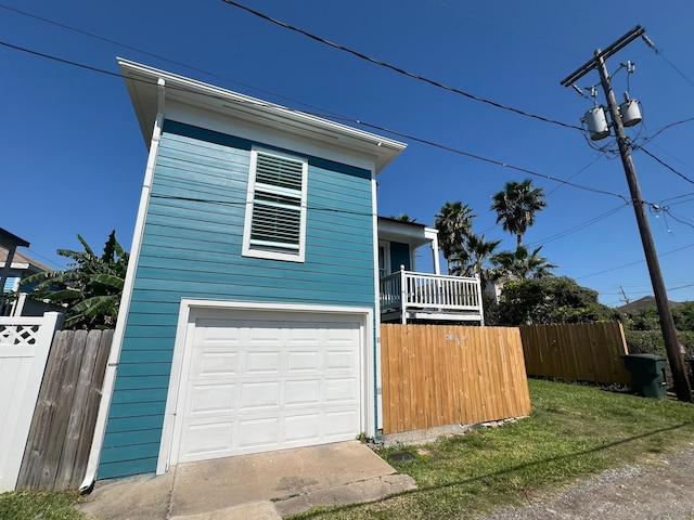 view of front facade with a garage and a front lawn