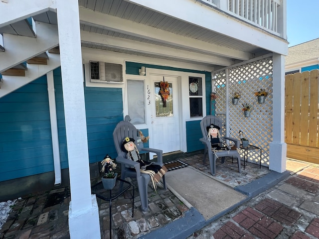 view of exterior entry with covered porch