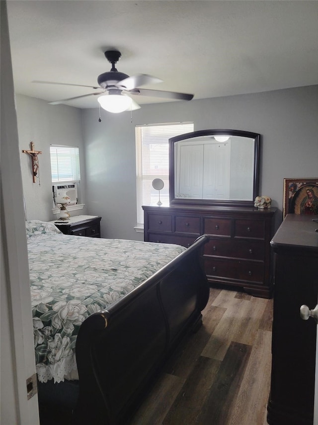 bedroom with hardwood / wood-style floors and ceiling fan