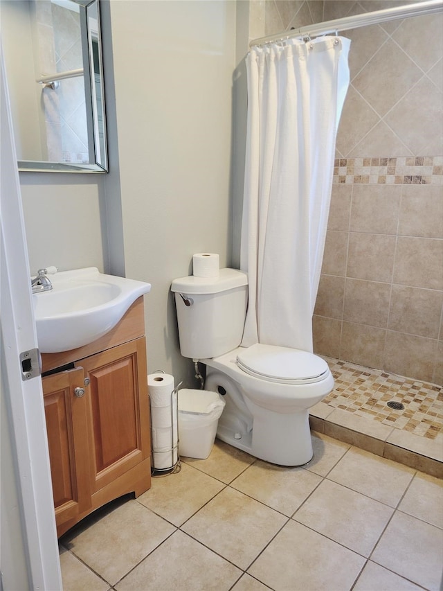 bathroom featuring vanity, toilet, tile patterned flooring, and a shower with shower curtain