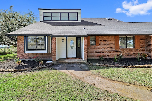 view of front of home with a front lawn