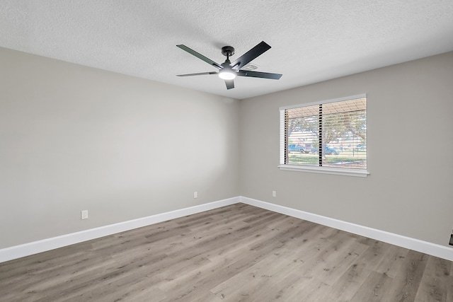 unfurnished room featuring a textured ceiling, ceiling fan, and light hardwood / wood-style flooring