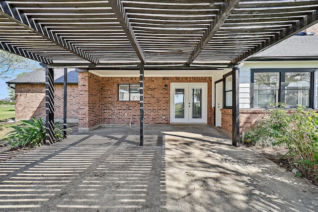 view of patio / terrace with a pergola and french doors