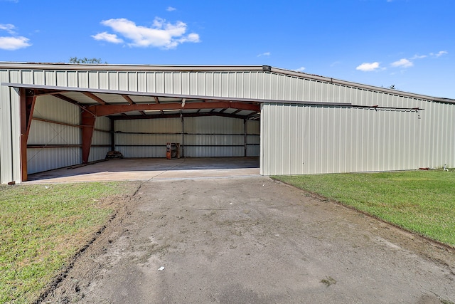 garage featuring a yard