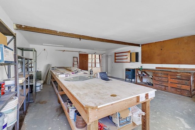 interior space featuring concrete floors and a workshop area