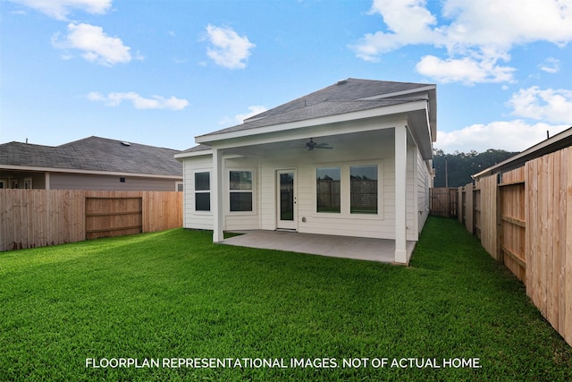 rear view of house with a lawn, a patio, and ceiling fan