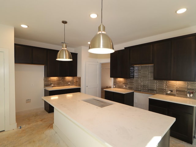 kitchen featuring pendant lighting, decorative backsplash, and a kitchen island