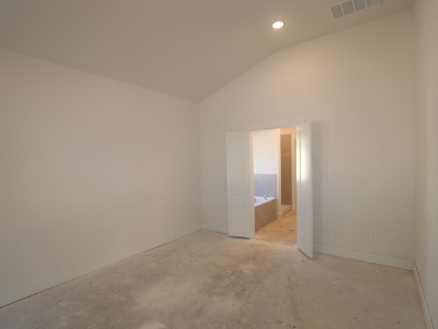 empty room with lofted ceiling