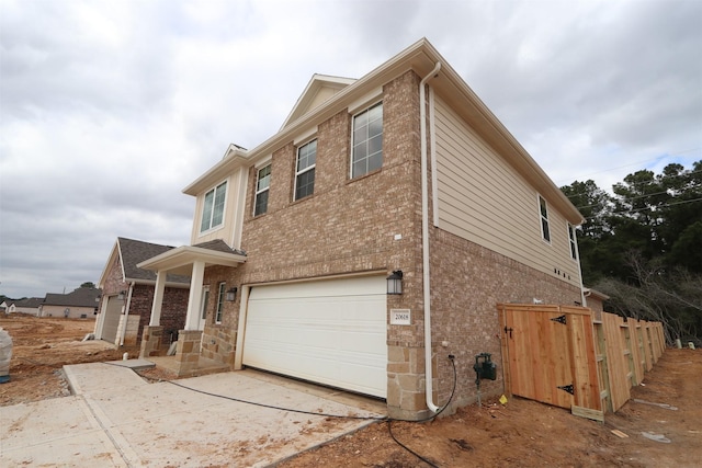 view of property exterior featuring a garage