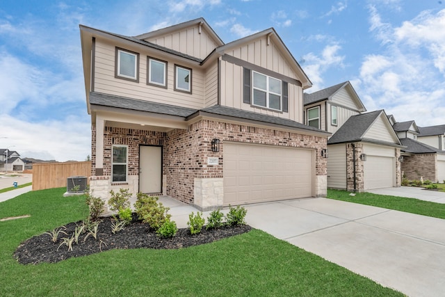 view of front of property featuring a front yard, a garage, and cooling unit