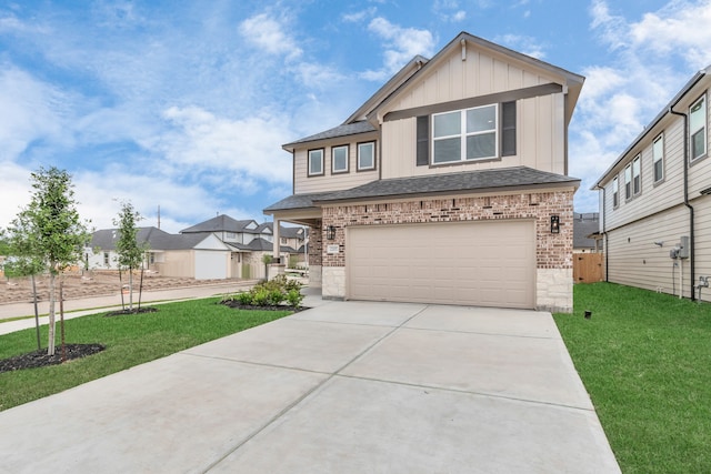 view of front of house with a front yard and a garage