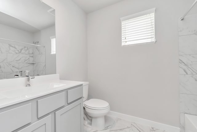 full bathroom with vanity, tiled shower / bath combo, and toilet