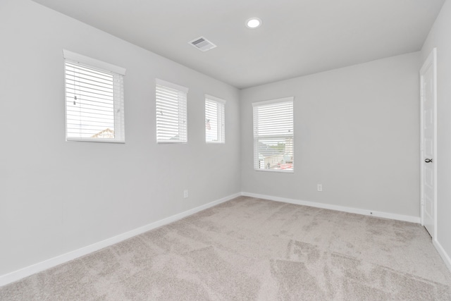 empty room featuring light colored carpet