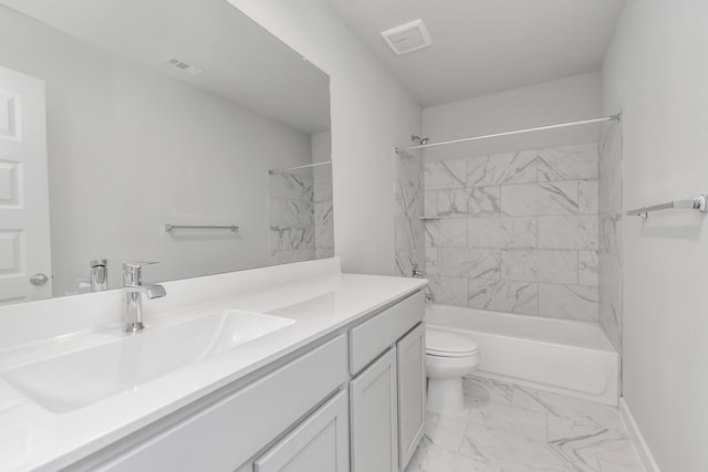 full bathroom featuring vanity, toilet, and tiled shower / bath