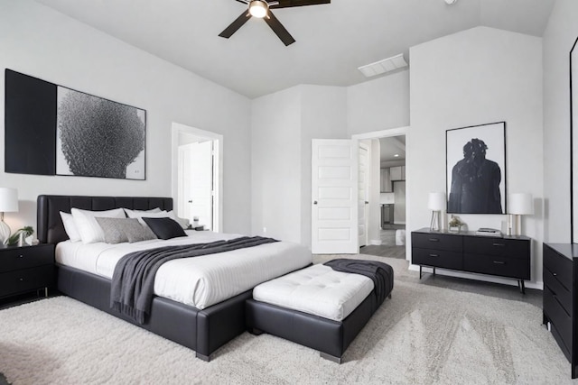 bedroom featuring lofted ceiling, carpet flooring, and ceiling fan