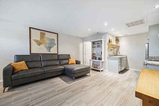 living room with light hardwood / wood-style flooring