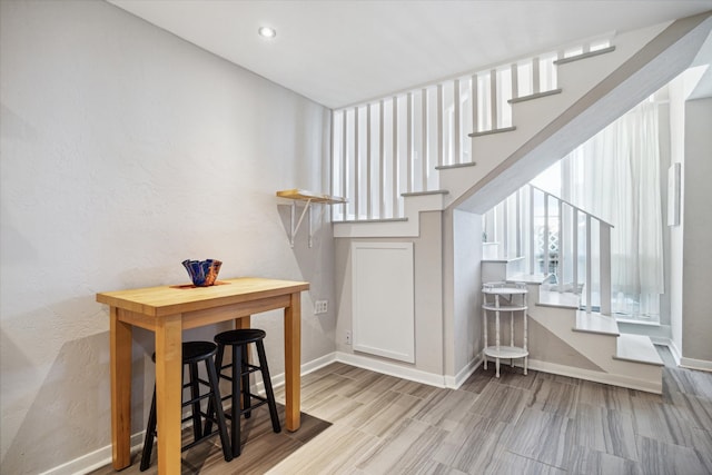 stairs with hardwood / wood-style floors