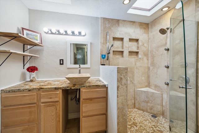 bathroom with vanity and an enclosed shower