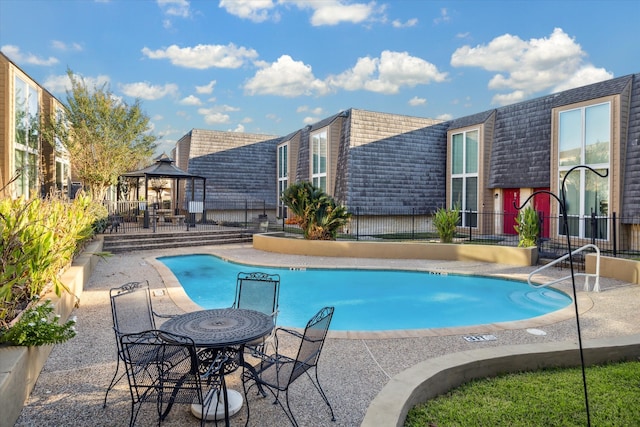 view of pool featuring a gazebo and a patio area