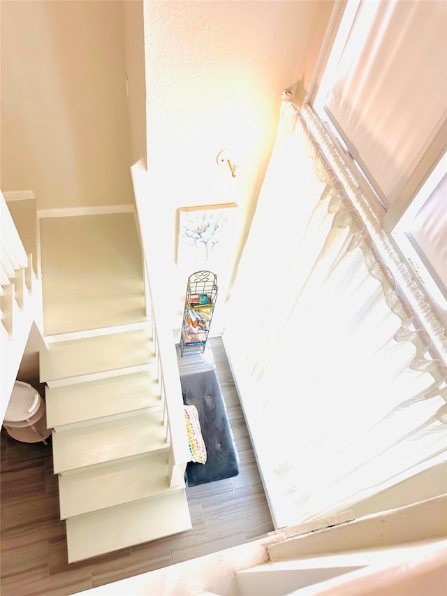 staircase featuring hardwood / wood-style flooring