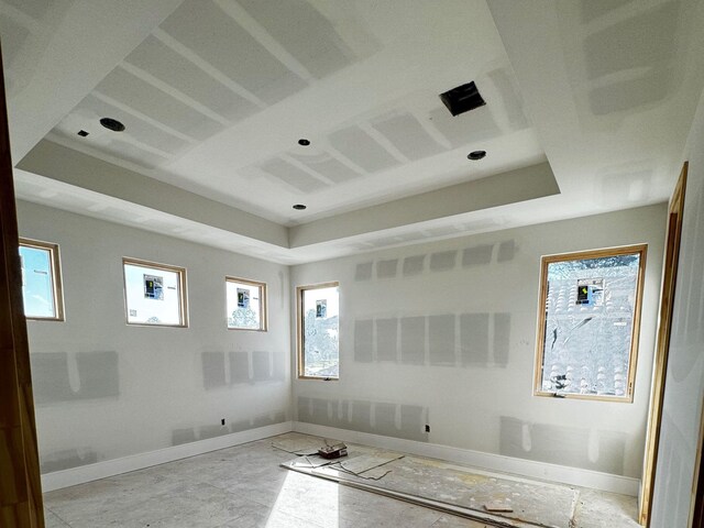 empty room with a tray ceiling