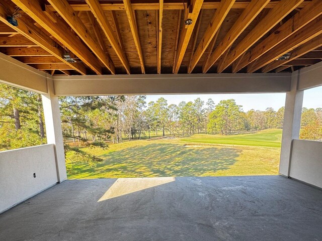 view of vehicle parking featuring a yard