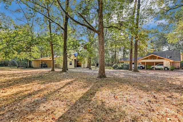 view of yard featuring a carport