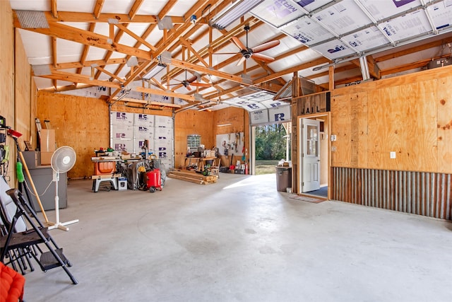 garage featuring wood walls