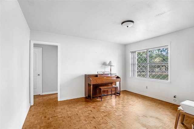 miscellaneous room with light parquet flooring