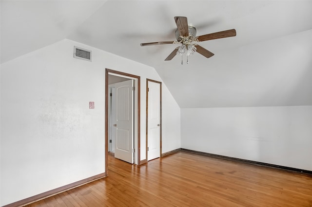 bonus room featuring lofted ceiling, hardwood / wood-style flooring, and ceiling fan