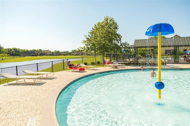 view of swimming pool featuring a water view