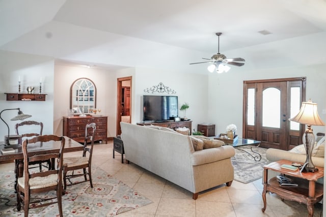 living room with ceiling fan and light tile patterned floors