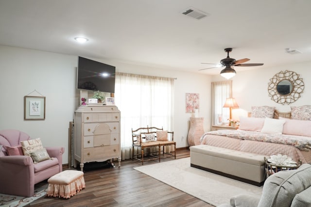 bedroom with dark wood-type flooring and ceiling fan