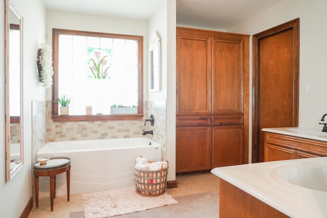 bathroom with vanity, a tub to relax in, and tile patterned floors