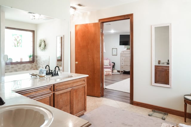 bathroom with vanity and wood-type flooring