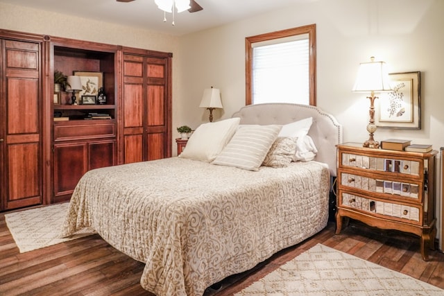 bedroom featuring dark hardwood / wood-style floors and ceiling fan